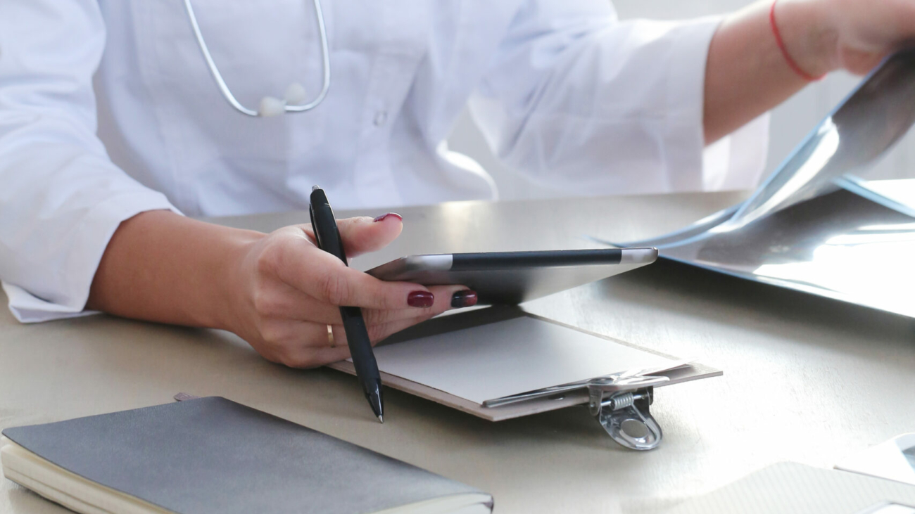 Medicine. Beautiful doctor by the table